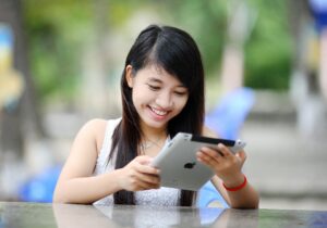 smiling woman on tablet