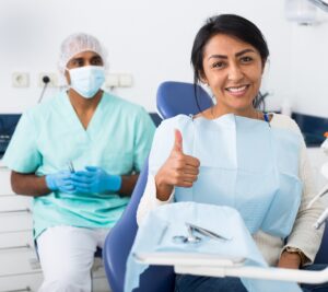 Portrait,Of,Satisfied,Latina,In,Dental,Office,Showing,Approval,Gesture