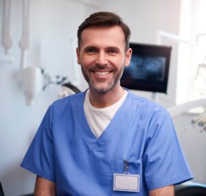 Portrait,Of,Smiling,Dentist,In,Dentist's,Office